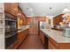Modern kitchen with stainless appliances, granite countertops, and ample cabinet space at 4538 Sterling Pointe Nw Dr, Kennesaw, GA 30152