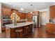 Modern kitchen boasts a center island, granite counters, stainless steel appliances, and dark cabinets at 4538 Sterling Pointe Nw Dr, Kennesaw, GA 30152