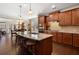 Gourmet kitchen with granite island, stainless steel appliances, and hardwood floors at 4538 Sterling Pointe Nw Dr, Kennesaw, GA 30152