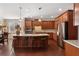 Gourmet kitchen has an island with bar seating, granite countertops, and stainless steel appliances at 4538 Sterling Pointe Nw Dr, Kennesaw, GA 30152