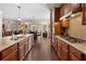 Open-concept kitchen features granite countertops, stainless appliances, and seamless flow to dining at 4538 Sterling Pointe Nw Dr, Kennesaw, GA 30152