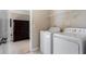 Bright laundry room featuring modern appliances and ample storage space at 4538 Sterling Pointe Nw Dr, Kennesaw, GA 30152