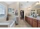 Relaxing main bathroom features a soaking tub, double vanity, and plenty of natural light at 4538 Sterling Pointe Nw Dr, Kennesaw, GA 30152