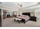 Spacious main bedroom with sitting area, fireplace, tray ceilings, and ample natural light at 4538 Sterling Pointe Nw Dr, Kennesaw, GA 30152