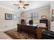 Home office with a large desk, natural light, and built-in bookshelves for storage and organization at 4538 Sterling Pointe Nw Dr, Kennesaw, GA 30152
