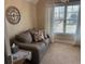 Cozy room with view, couch, and large clock at 4538 Sterling Pointe Nw Dr, Kennesaw, GA 30152
