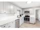 Bright kitchen with stainless steel appliances and white subway tile backsplash at 1340 Hawthorne Se Ave, Smyrna, GA 30080