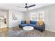 Cozy living room with a comfortable blue sectional and stylish decor at 1340 Hawthorne Se Ave, Smyrna, GA 30080
