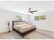 Main bedroom features light gray walls, two windows, modern ceiling fan, and neutral decor at 1340 Hawthorne Se Ave, Smyrna, GA 30080