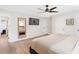 Main bedroom features light gray walls, two closets, hardwood floors, modern ceiling fan, and neutral decor at 1340 Hawthorne Se Ave, Smyrna, GA 30080
