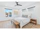 Bright bedroom with large windows, hardwood floors, ceiling fan, and minimalistic decor at 2424 Memorial Se Dr # 3, Atlanta, GA 30317