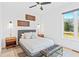 Comfortable bedroom showcasing modern decor, including wall art, bedside tables, and a large window at 2424 Memorial Se Dr # 3, Atlanta, GA 30317
