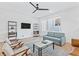 Bright living room with hardwood floors, ceiling fan, and neutral-toned furniture at 2424 Memorial Se Dr # 3, Atlanta, GA 30317