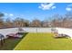 Entertainment ready rooftop deck featuring cornhole game, artificial turf, and comfortable seating at 2424 Memorial Se Dr # 3, Atlanta, GA 30317