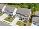 A great aerial view of a beautiful home and well kept lawn in a suburban neighborhood on a sunny day at 2770 Westgate Park Dr, Loganville, GA 30052