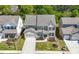 Aerial view of a well-maintained two-story home with a lush green lawn and manicured landscaping at 2770 Westgate Park Dr, Loganville, GA 30052