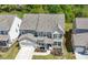 Aerial view of home highlighting the front elevation, landscaping, and garage at 2770 Westgate Park Dr, Loganville, GA 30052
