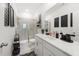 Modern bathroom showcasing a glass-enclosed shower and a stylish vanity with dual sinks at 2770 Westgate Park Dr, Loganville, GA 30052