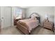 Cozy bedroom with a bed, makeup table and a bright window view at 2770 Westgate Park Dr, Loganville, GA 30052