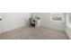 Bright bedroom featuring carpet, two windows, and vanity desk with chair at 2770 Westgate Park Dr, Loganville, GA 30052