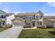 Charming two-story home featuring a two-car garage, manicured lawn, and inviting front porch at 2770 Westgate Park Dr, Loganville, GA 30052