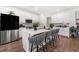 Modern white kitchen featuring stainless steel appliances, a center island, and bar stool seating at 2770 Westgate Park Dr, Loganville, GA 30052