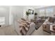 Inviting living room with comfortable seating, a neutral color palette, and natural light from the windows at 2770 Westgate Park Dr, Loganville, GA 30052