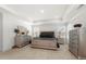 Elegant main bedroom with a tray ceiling and featuring stylish furnishings and plenty of natural light at 2770 Westgate Park Dr, Loganville, GA 30052