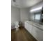 Bathroom featuring double sinks, modern fixtures, and neutral paint for a serene experience at 3870 Spring Moss Cir, Snellville, GA 30039