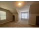Well-lit carpeted bedroom with windows and interesting architectural details, providing a relaxing space at 3870 Spring Moss Cir, Snellville, GA 30039