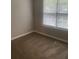 Bright carpeted bedroom with natural light from the window, creating a peaceful atmosphere at 3870 Spring Moss Cir, Snellville, GA 30039