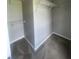 Spacious walk-in closet with ample shelving and carpet, offering plenty of storage space at 3870 Spring Moss Cir, Snellville, GA 30039