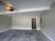 Interior view of the empty two car garage with neutral painted walls at 3870 Spring Moss Cir, Snellville, GA 30039