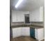 Kitchen with white cabinets, granite countertops, stainless steel sink, and laminate flooring at 3870 Spring Moss Cir, Snellville, GA 30039