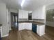 Updated kitchen featuring white cabinets, granite countertops, and stainless steel appliances at 3870 Spring Moss Cir, Snellville, GA 30039