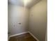An empty laundry room with connections ready for washer and dryer at 3870 Spring Moss Cir, Snellville, GA 30039