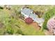 Aerial view of a home with a large yard, mature trees, and outdoor living spaces at 640 Saddle Ridge Trce, Roswell, GA 30076