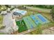 Aerial view of community amenities includes a pool, tennis courts, basketball courts, playground, and landscaped green space at 640 Saddle Ridge Trce, Roswell, GA 30076