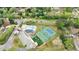 Aerial view of community amenities including pool, tennis, basketball, and playground with green spaces and a parking area at 640 Saddle Ridge Trce, Roswell, GA 30076