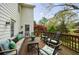 Outdoor deck furnished with seating and rocking chairs, overlooking a lush, landscaped backyard at 640 Saddle Ridge Trce, Roswell, GA 30076
