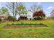 Spacious backyard with a deck and mature trees, ideal for outdoor activities at 640 Saddle Ridge Trce, Roswell, GA 30076