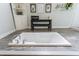 This bathroom features a built-in bathtub surrounded by tile and white cabinetry for storage at 640 Saddle Ridge Trce, Roswell, GA 30076