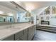 Spacious bathroom with a double vanity, modern finishes, and a large mirror at 640 Saddle Ridge Trce, Roswell, GA 30076