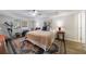 Bedroom features comfortable bed, ceiling fan, traditional decor, complemented by decorative rug and exercise equipment at 640 Saddle Ridge Trce, Roswell, GA 30076