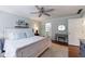 Inviting bedroom with a ceiling fan, hardwood floors, and a connecting bathroom at 640 Saddle Ridge Trce, Roswell, GA 30076