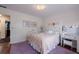 This bedroom is bright with light and decorated with pink accents. It is carpeted with purple carpet at 640 Saddle Ridge Trce, Roswell, GA 30076