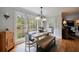 Bright dining area features a large window overlooking the backyard and a classic chandelier at 640 Saddle Ridge Trce, Roswell, GA 30076
