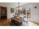 Dining room showcases a large window, wainscoting, and classic chandelier lighting at 640 Saddle Ridge Trce, Roswell, GA 30076