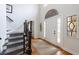 Elegant foyer featuring hardwood floors, a staircase, and a bright, airy atmosphere at 640 Saddle Ridge Trce, Roswell, GA 30076