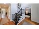 Welcoming foyer with hardwood floors, staircase, and access to living spaces at 640 Saddle Ridge Trce, Roswell, GA 30076